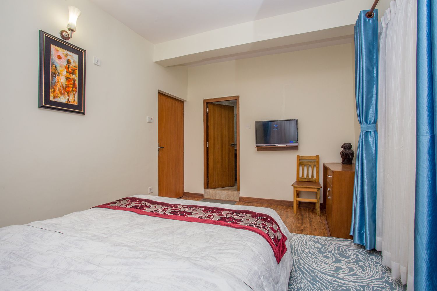 Ama Dablam Suite — the bedroom, with flat-screen tv