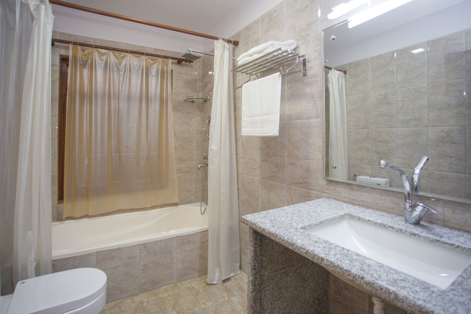 Cho Oyu Suite — en-suite bathroom with bathtub and rain shower