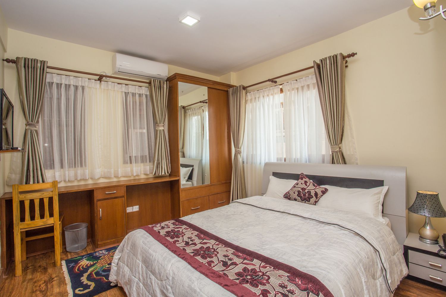 Dhaulagiri Suite — the bedroom, bright and air-conditioned