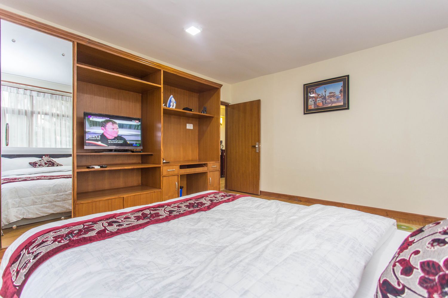 Kanchenjunga Suite — private bedroom with wardrobe, work desk & tv